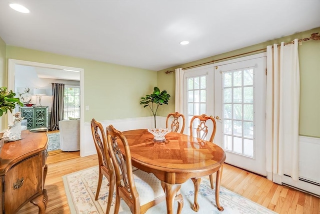 1441 Old Post Rd, Barnstable, MA 02648 - dining space with wainscoting, light wood-style flooring, recessed lighting, french doors, and a baseboard radiator