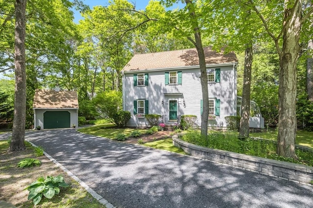 1441 Old Post Rd, Barnstable, MA 02648 - colonial-style house with an outbuilding, a garage, and driveway