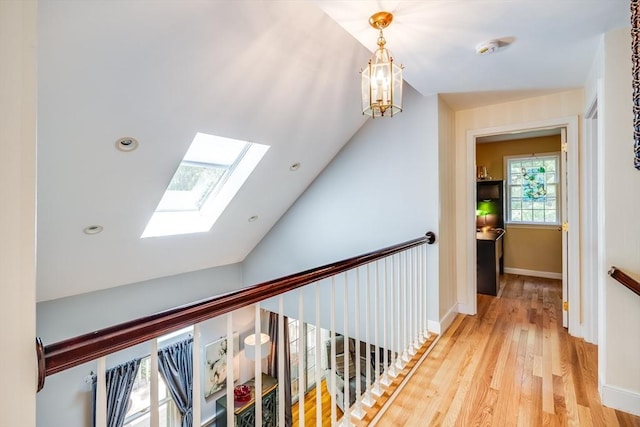 1441 Old Post Rd, Barnstable, MA 02648 - hall with a skylight, light wood-style floors, vaulted ceiling, and a chandelier