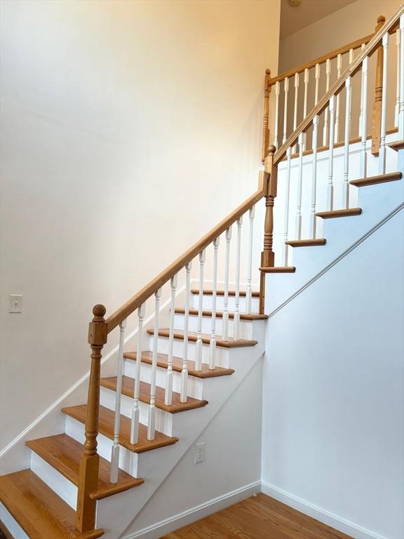 99 Dudley Rd, Oxford, MA 01540 - staircase with wood finished floors and baseboards