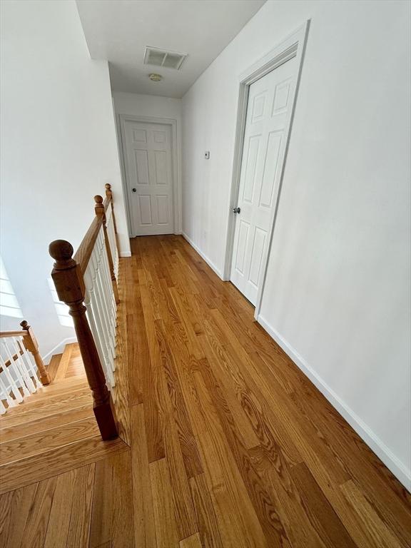 99 Dudley Rd, Oxford, MA 01540 - hall with an upstairs landing, baseboards, and wood finished floors