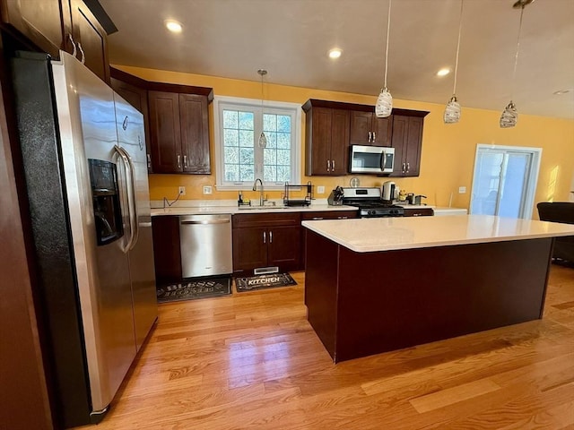 99 Dudley Rd, Oxford, MA 01540 - kitchen featuring stainless steel appliances, a sink, light wood-style floors, light countertops, and recessed lighting