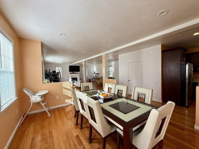 99 Dudley Rd, Oxford, MA 01540 - dining area with a fireplace, light wood-style flooring, baseboards, and recessed lighting