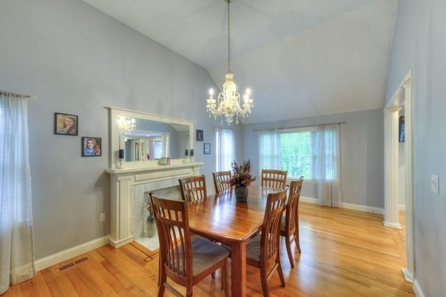15 Bailin Dr, Worcester, MA 01604 - dining space featuring light wood-type flooring, high vaulted ceiling, a chandelier, and baseboards