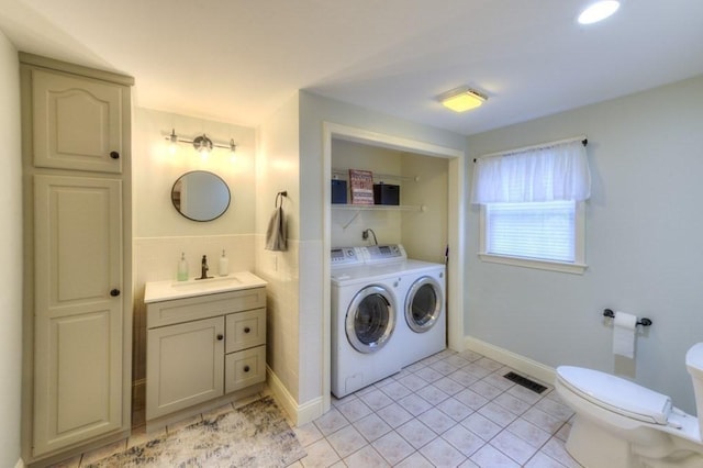 15 Bailin Dr, Worcester, MA 01604 - bathroom featuring washer and dryer, vanity, tile patterned floors, toilet, and tile walls
