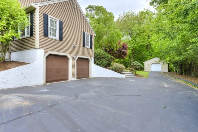 15 Bailin Dr, Worcester, MA 01604 - view of home's exterior with a garage, asphalt driveway, and an outdoor structure
