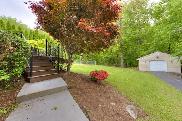 15 Bailin Dr, Worcester, MA 01604 - view of grassy yard featuring an outdoor structure, stairway, a garage, and driveway