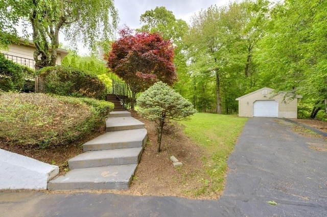 15 Bailin Dr, Worcester, MA 01604 - view of front of property with stairway, an outbuilding, a garage, driveway, and a front yard