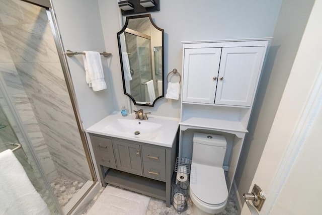 bathroom featuring toilet, vanity, and an enclosed shower