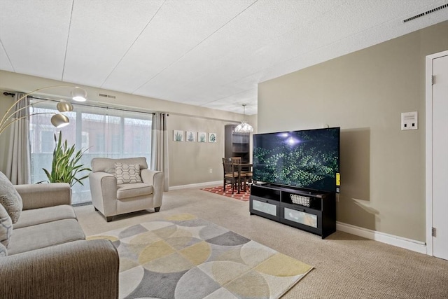 10 Foster St Unit 203, Wakefield, MA 01880 - living room featuring carpet flooring, visible vents, baseboards, and a chandelier