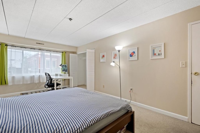 10 Foster St Unit 203, Wakefield, MA 01880 - bedroom with baseboards, carpet flooring, and visible vents