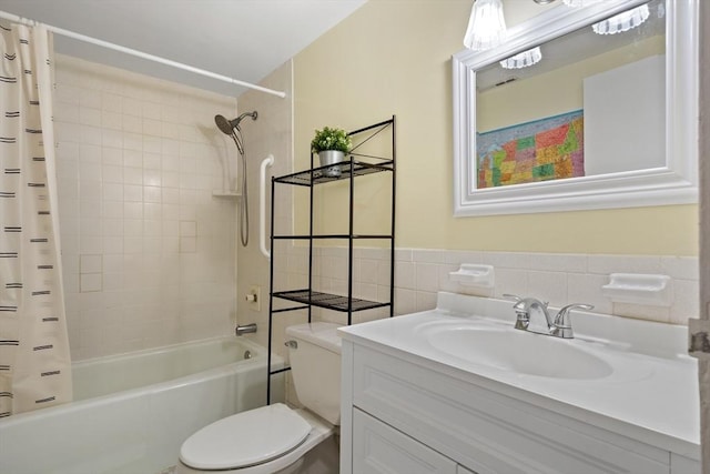 10 Foster St Unit 203, Wakefield, MA 01880 - bathroom with vanity, tile walls, toilet, and shower / bath combination with curtain