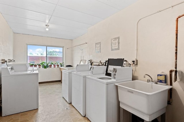 10 Foster St Unit 203, Wakefield, MA 01880 - shared laundry area with washer and dryer and a sink