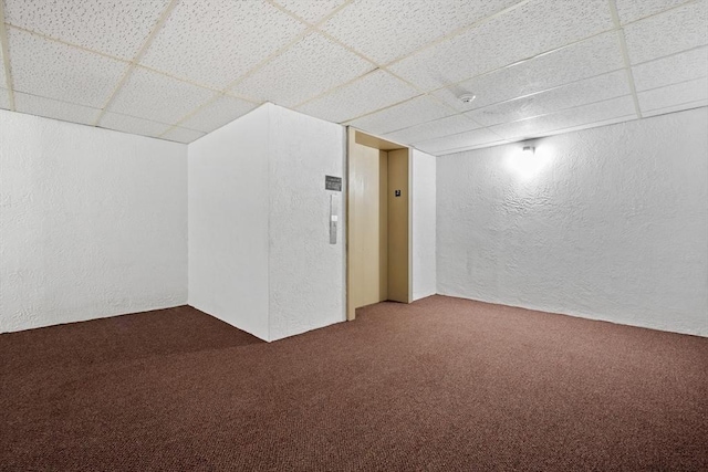10 Foster St Unit 203, Wakefield, MA 01880 - bonus room with elevator, carpet, and a textured wall