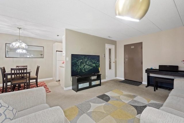 10 Foster St Unit 203, Wakefield, MA 01880 - living room with a chandelier, light carpet, and baseboards
