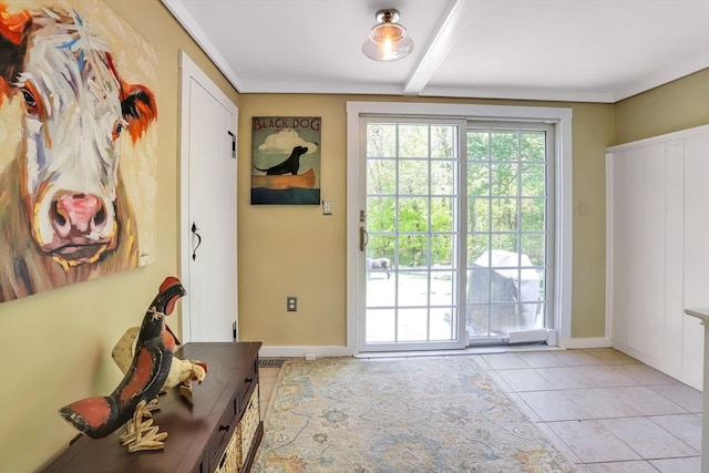 doorway to outside with light tile patterned floors, beamed ceiling, and baseboards