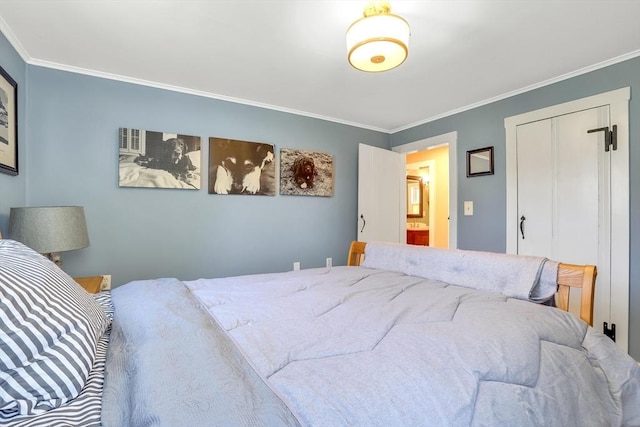 bedroom featuring ornamental molding and a closet