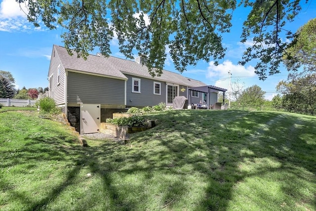 rear view of property featuring a pergola