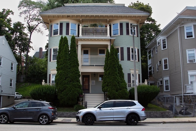 view of front of house featuring a balcony