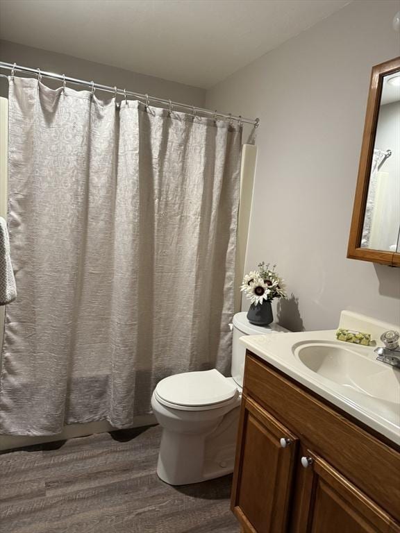 50 Juniper Rd Unit 1C, North Attleboro, MA 02760 - full bathroom with wood finished floors, toilet, vanity, and curtained shower