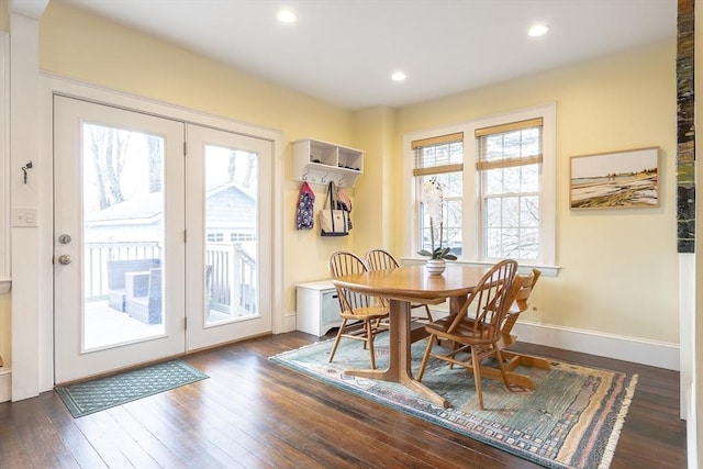 dining space with baseboards, dark wood-style flooring, and recessed lighting