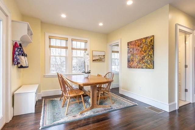 dining room featuring visible vents, baseboards, dark wood-type flooring, and recessed lighting