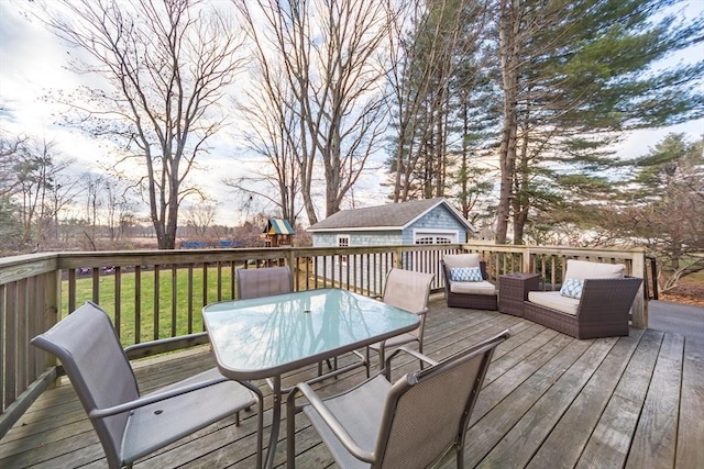 wooden terrace with a lawn, outdoor dining area, a playground, and an outdoor structure