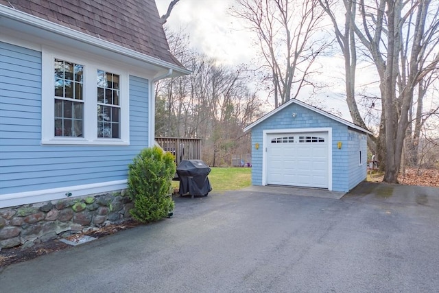 detached garage featuring driveway