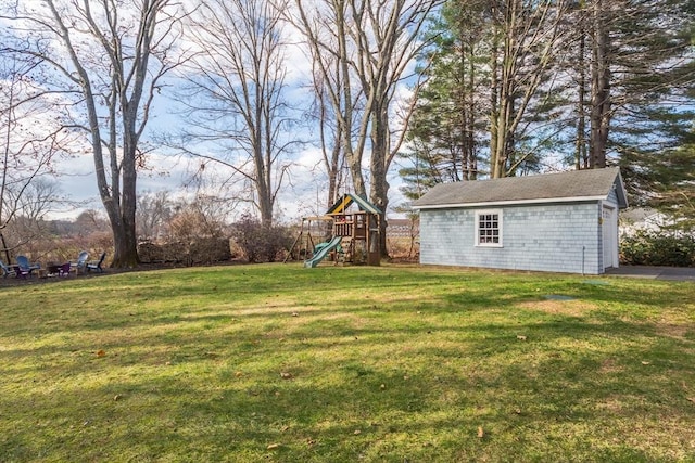 view of yard with an outbuilding and a playground