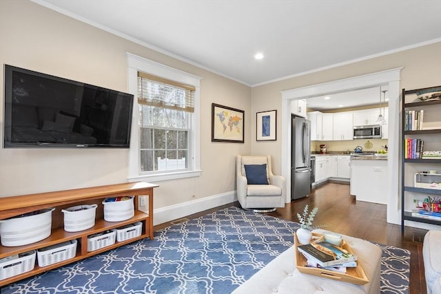 living area with baseboards, dark wood finished floors, crown molding, and recessed lighting