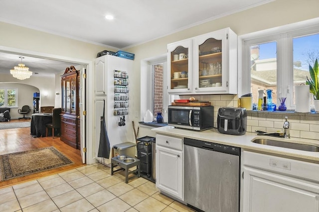 kitchen with white cabinetry, appliances with stainless steel finishes, and sink