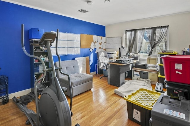 home office with hardwood / wood-style floors