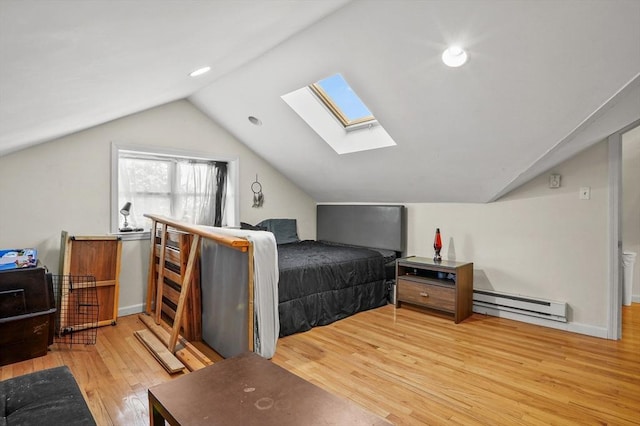 bedroom featuring wood-type flooring, vaulted ceiling, and baseboard heating