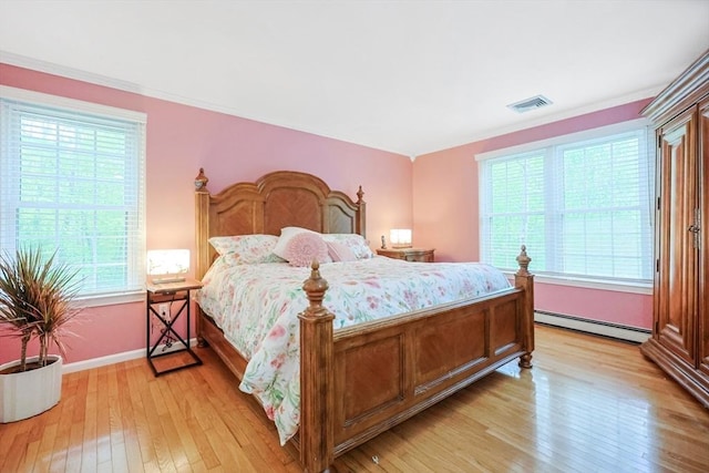 8 Rock Rd, Attleboro, MA 02703 - bedroom featuring a baseboard radiator, light wood finished floors, multiple windows, and baseboards
