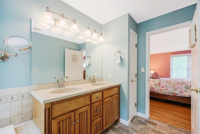 8 Rock Rd, Attleboro, MA 02703 - bathroom featuring double vanity, ensuite bath, and wood finished floors