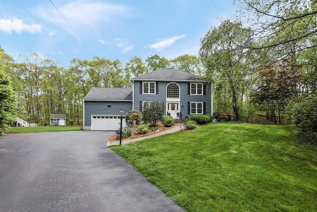 8 Rock Rd, Attleboro, MA 02703 - colonial home with asphalt driveway, a garage, and a front yard