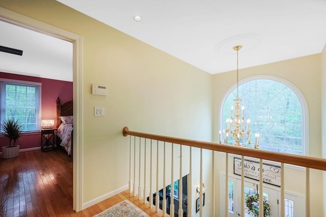 8 Rock Rd, Attleboro, MA 02703 - hall featuring a chandelier, hardwood / wood-style flooring, baseboards, and an upstairs landing