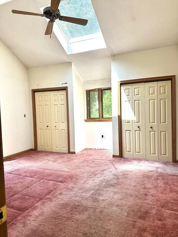 117 Metropolitan Ave Unit 117, Ashland, MA 01721 - carpeted foyer entrance with ceiling fan, lofted ceiling, and a skylight