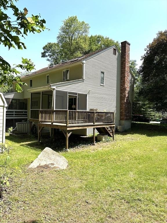 117 Metropolitan Ave Unit 117, Ashland, MA 01721 - back of property with a yard, a deck, and a chimney
