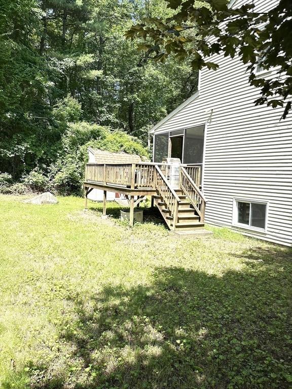 117 Metropolitan Ave Unit 117, Ashland, MA 01721 - view of green lawn featuring a wooden deck and stairs