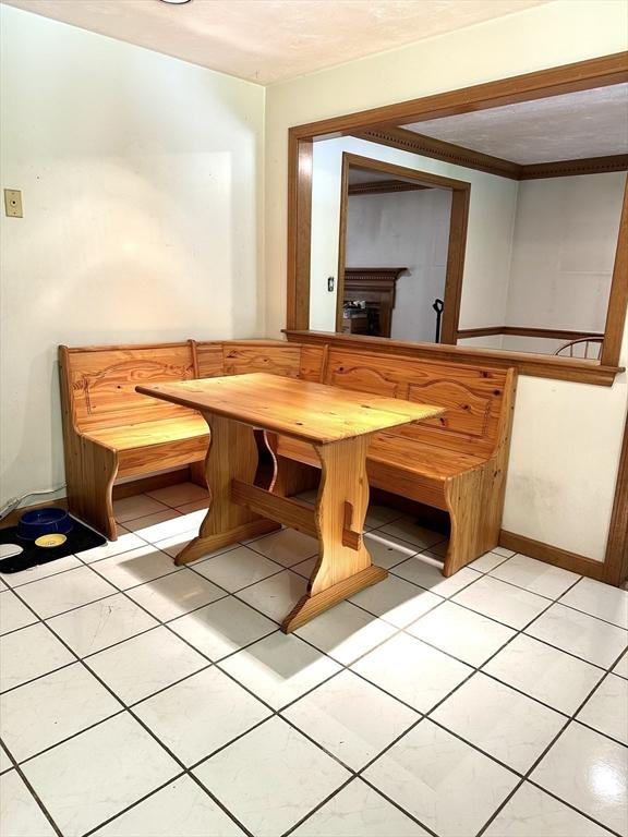 117 Metropolitan Ave Unit 117, Ashland, MA 01721 - unfurnished dining area featuring breakfast area and light tile patterned flooring