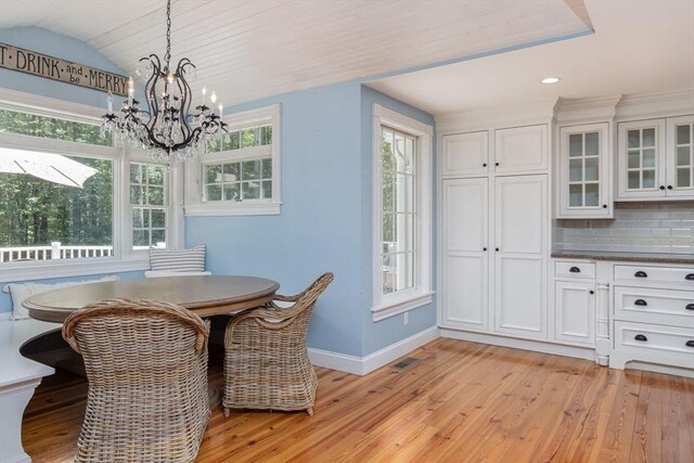 8 Whitaker Ln, Groton, MA 01450 - dining area with baseboards, a chandelier, light wood-type flooring, vaulted ceiling, and recessed lighting