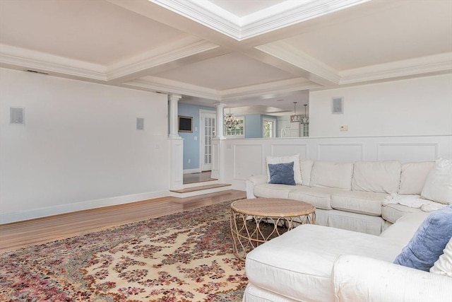 8 Whitaker Ln, Groton, MA 01450 - living area featuring wood finished floors, decorative columns, crown molding, beamed ceiling, and coffered ceiling
