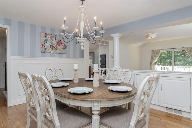 8 Whitaker Ln, Groton, MA 01450 - dining room featuring a wainscoted wall, light wood-style flooring, a chandelier, wallpapered walls, and a decorative wall