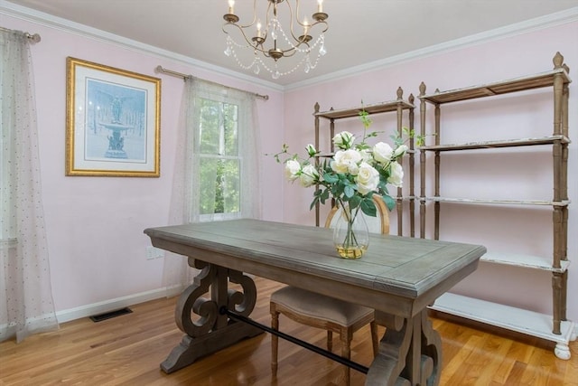 8 Whitaker Ln, Groton, MA 01450 - dining space featuring a chandelier, wood finished floors, baseboards, and crown molding