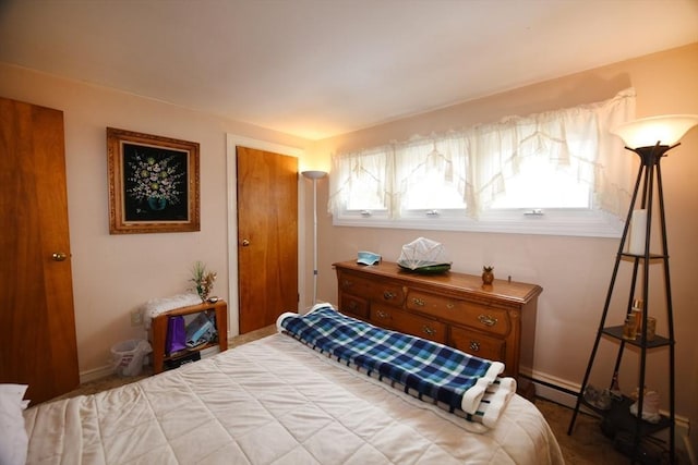 bedroom featuring baseboards, multiple windows, and baseboard heating