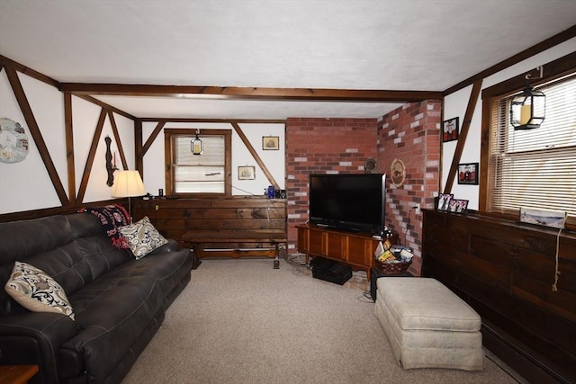 living room featuring carpet and beamed ceiling