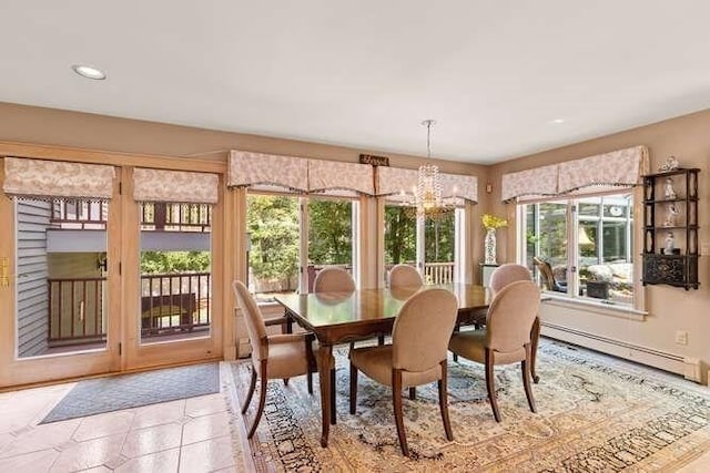 dining area with a chandelier, a baseboard heating unit, and recessed lighting