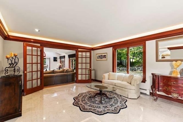 living area with crown molding, french doors, a baseboard radiator, and marble finish floor