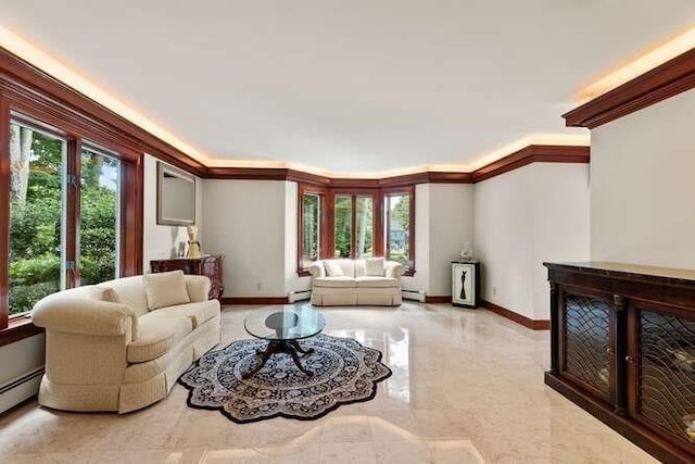 living area featuring crown molding, a baseboard heating unit, baseboards, and a baseboard radiator